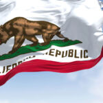 Picture of the California state flag flying in the wind