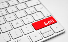 Upwelling tells LPs it is time to bite the bullet Red Sell button on a white keyboard isolated on a white background