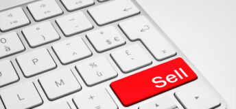 Red Sell button on a white keyboard isolated on a white background