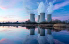How VCs are helping wean data centers off fossil fuels Nuclear power plant with dusk landscape.