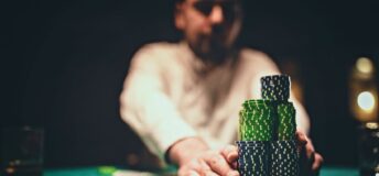 Photo of player going all in when playing a game of poker.