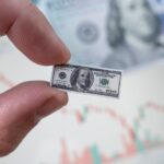 Photo concept of money shrinking in size.