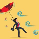 Against the wind Image of businessperson struggling against wind.