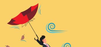 Image of businessperson struggling against wind.